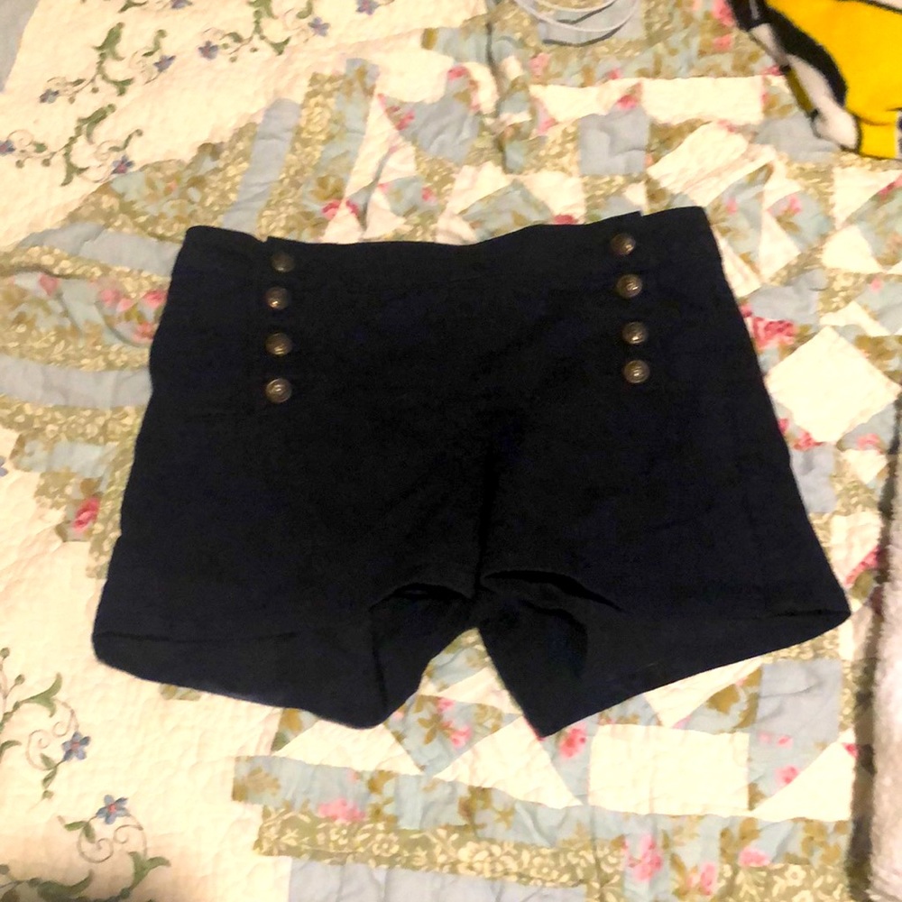 black high waist; bronze buttons down the side